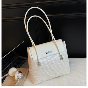 Detailed close-up of cream white snake-embossed PU leather tote bag with thin double straps