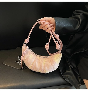 Pink dumpling bag with butterfly floral prints and a stylish knotted shoulder strap