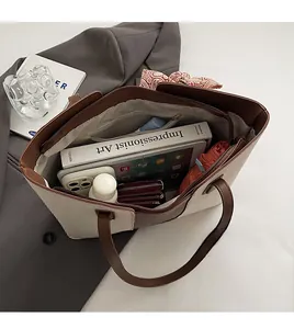 Spacious interior of canvas tote bag showing large capacity for books and daily essentials
