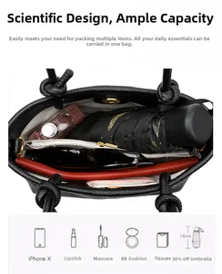 Top view of black pebbled leather bag interior showing large capacity and zipper pocket