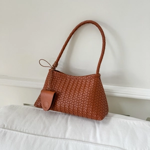 Brown woven leather shoulder bag with a sleek trapezoid shape and top handle