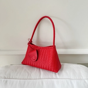 Minimalist red woven leather underarm handbag with intrecciato texture and matching handle