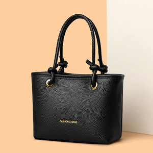 Minimalist black pebble leather tote bag with FASHION & BAGS logo and golden details