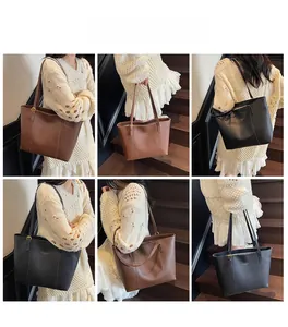Detailed views of high-capacity tote bags in dark brown and black with leather finish