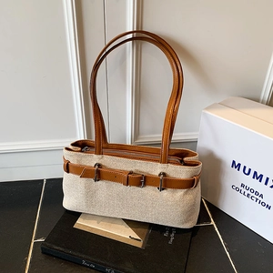Retro canvas underarm bag with contrast leather strap and polished buckle detail