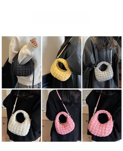 Quilted cloud shoulder bag shown in black, yellow, silver, white and pink colors