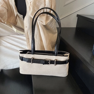 Chic beige canvas underarm bag with black leather strap decoration and buckle detail