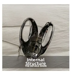 Macro view of silver acrylic bag interior structure with magnetic closure and chain