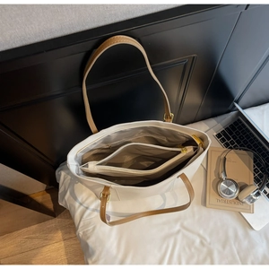 Top view showing the spacious interior and compartments of this white leather tote bag