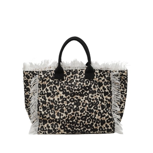 Large leopard print tote bag with white fringe edges and braided black rope handles