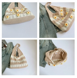 Detail of hand-knitted tote bag with yellow daisy flowers and striped crochet texture