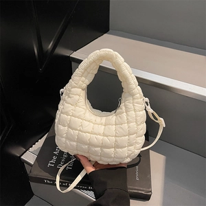 Minimalist cream white quilted cloud bag with puffy texture and adjustable strap