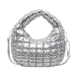 Chic silver metallic quilted cloud bag with puffy lattice pattern and crossbody strap