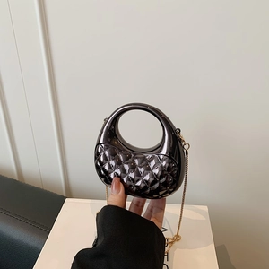 Mini acrylic crossbody bag with gunmetal metallic finish and gold chain strap