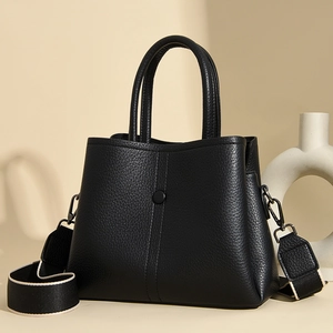 Chic black litchi leather handbag with stylish wide woven strap for women