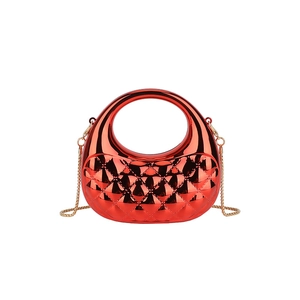 Glossy red acrylic tote bag with diamond quilted texture and golden chain strap