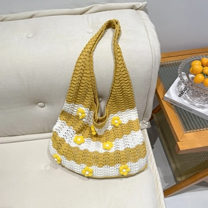 Handmade crochet tote bag with yellow floral accents and beach vacation style stripes