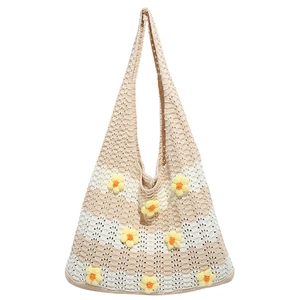 Handmade crochet tote bag with 3D floral accents and beige striped knit for beach vacations