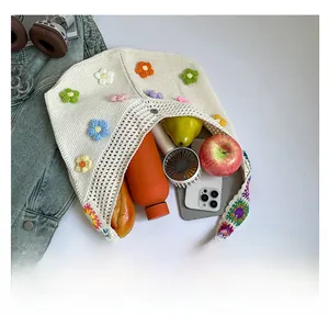 Macro view of large capacity floral crochet tote bag showing interior storage space