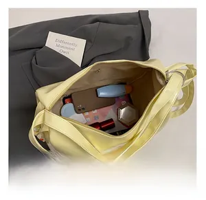 Top view of yellow tote bag interior showing spacious capacity with zipper pocket