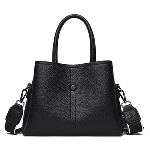 Retro black litchi texture leather handbag with wide woven strap and round top handles