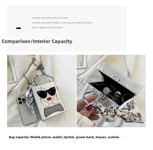 Silver textured handbag featuring a fashion portrait and metal snake chain strap