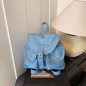 Retro denim backpack with large capacity and dual front pockets for travel and commute