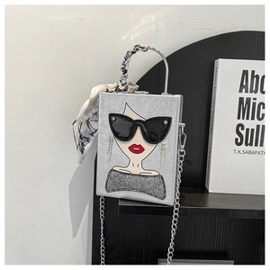 Silver square handbag with pop art female illustration and scarf-wrapped handle