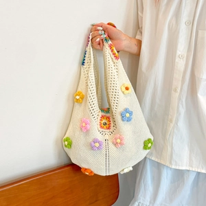 Minimalist beige crochet tote bag with colorful 3D knitted flowers and woven straps