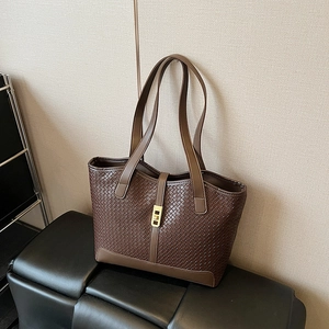 Brown woven texture tote bag with golden buckle closure and spacious shoulder design