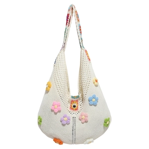 Handmade crochet hobo bag with colorful floral patterns and hollow knit design