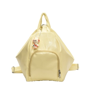 Minimalist cream yellow geometric backpack with cute astronaut bunny charm on white background