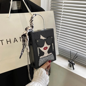 Fashionable black box clutch with graphic print, silk scarf handle and silver chain strap