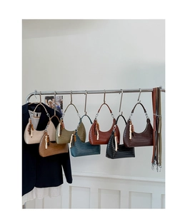 Detailed display of seven woven hobo bags in various colors with wooden bead tassels