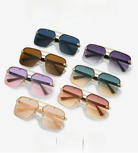 Collection of oversized square sunglasses in seven vibrant gradient colors with gold metal beams