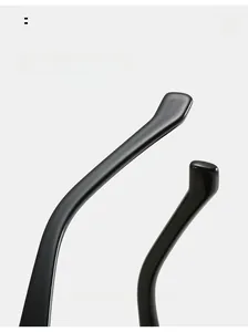 Detail of curved ergonomic temple tips on black cat-eye sunglasses for comfortable wear