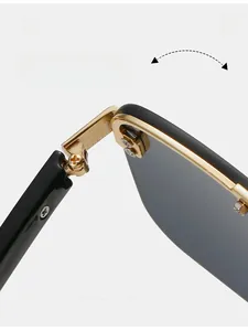 Close-up of durable golden metal hinge on black sunglasses with cross screw detail