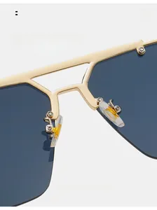 Detail of comfortable silicone nose pads on gold metal sunglasses for long-term wear