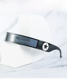 Detail showing high-tech futuristic visor sunglasses with black star badge on marble