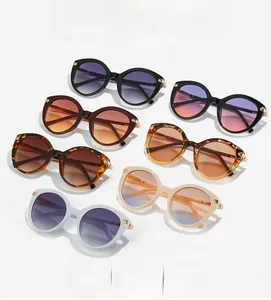 Collection of oversized round sunglasses in seven colors with elegant gold hinge details