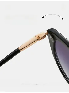 Close-up of durable gold metal hinge on fashion sunglasses with gradient purple lenses