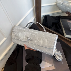 Pochette a busta glitterata argento con trama a onde e chiusura a nodo metallico da donna