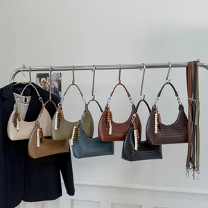Large woven hobo shoulder bags in various colors with elegant beaded tassel detail