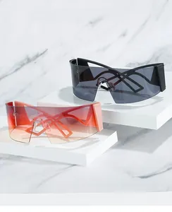 Detail of futuristic oversized wraparound sunglasses with hollow geometric temples on marble