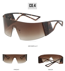 Three-view display of futuristic oversized shield sunglasses with tortoise shell texture