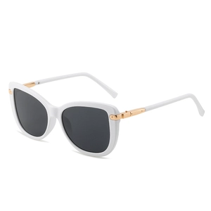 White cat-eye sunglasses with gold metal accents and dark grey lenses in 45-degree view