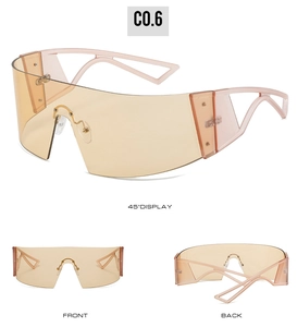 Three-angle view of futuristic amber oversized shield sunglasses with hollow geometric temples