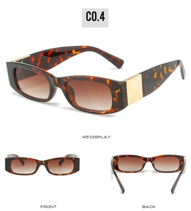 Detail view of retro tortoiseshell sunglasses with gradient lenses and gold accents