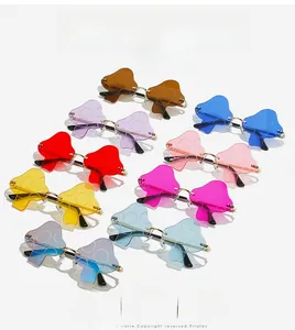 Array of colorful mushroom shaped rimless sunglasses with metallic frames and lenses
