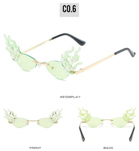 Detailed view of flame-shaped rimless sunglasses with white pearls and gold metal frames